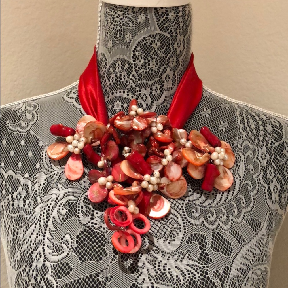 Red statement necklace made with real pearls.